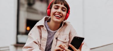 Young lady wearing red headphones