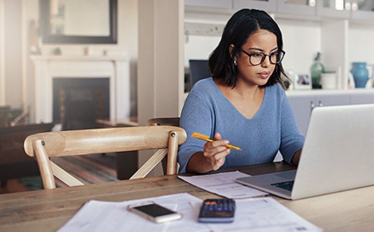 Young professional using her laptop