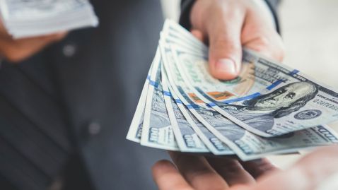 Teller handing over money