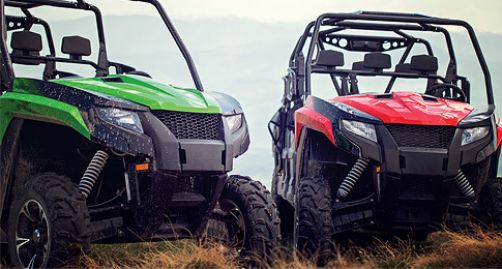 ATVs parked in a field