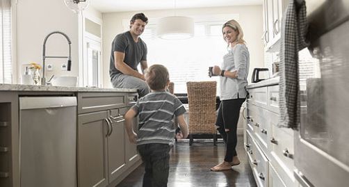 Family with children in their kitchen