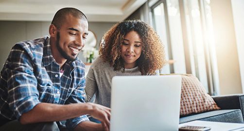 Couple using their laptop