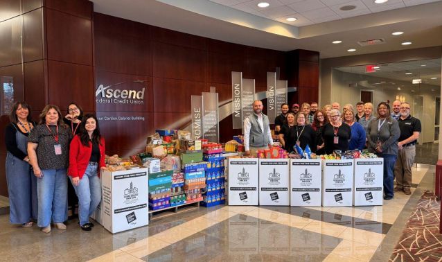 Ascend employees pose with food donations