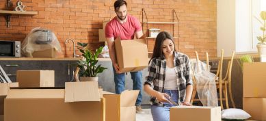 Couple packing boxes before a move.