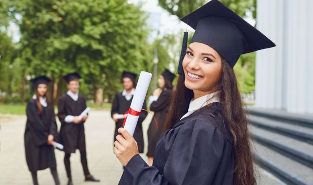 Woman graduate holding a diploma