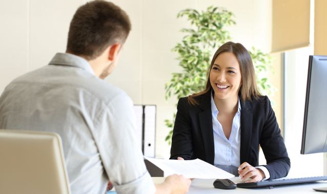 An employee talks with a customer.