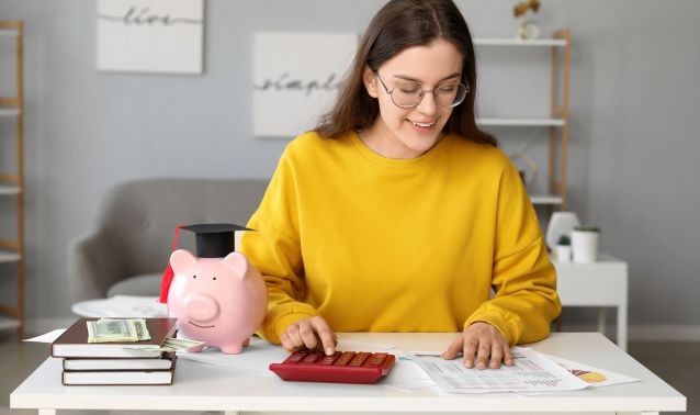 College woman using calculator