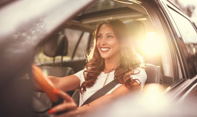 Woman smiling in car