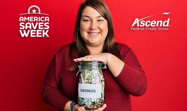 A woman holding a savings jar.