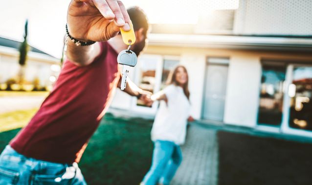 two new homeowners enter their home for the first time
