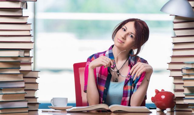 A student surrounded by books