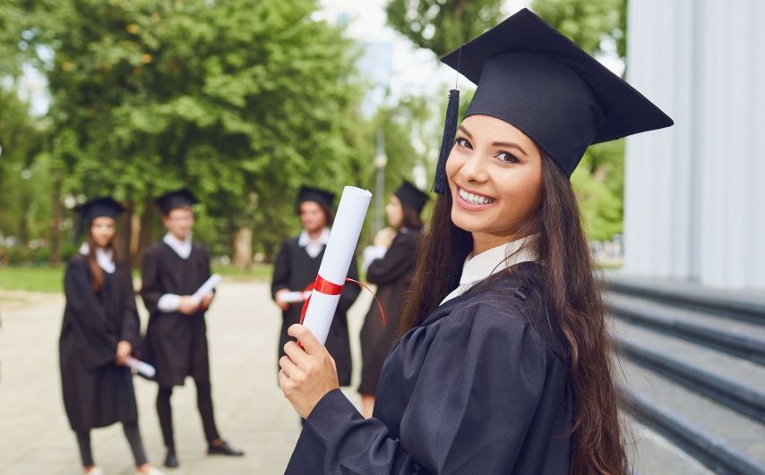 Woman graduate holding a diploma