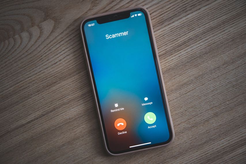 A phone showing a spam call.