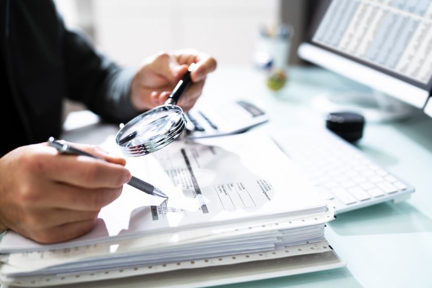 A tax expert analyzing documents.