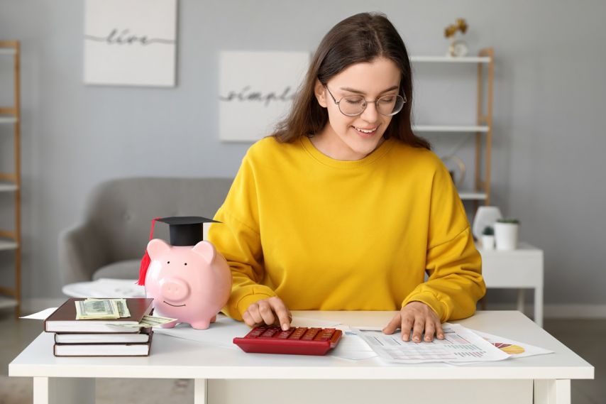 College woman using calculator