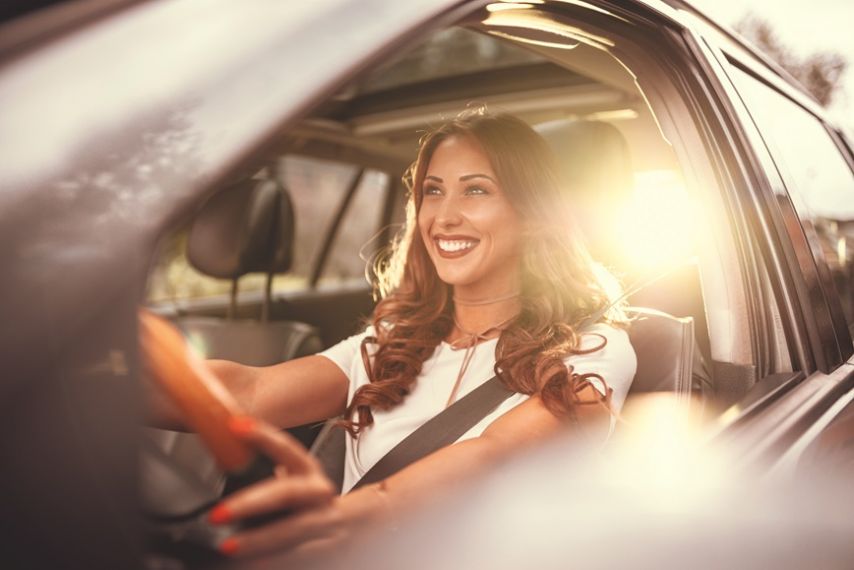 Woman smiling in car