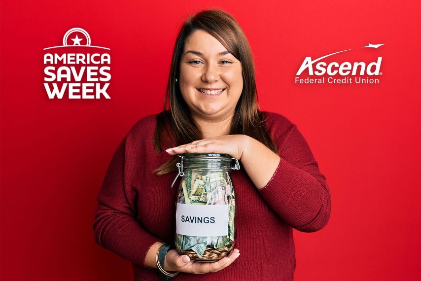 A woman holding a savings jar.