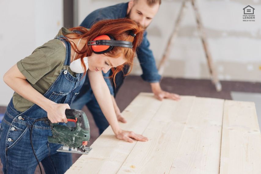 two homeowners saw a plank for home improvement