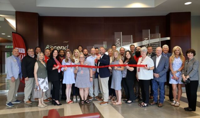 Ascend team members and guests pose for photo in celebration of Ascend Federal Credit Union's 75th anniversary