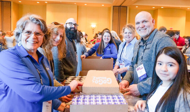 Ascend employees pack kits for Second Harvest