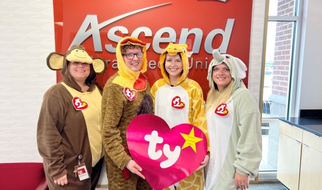 Ascend branch employees pose in their halloween costumes