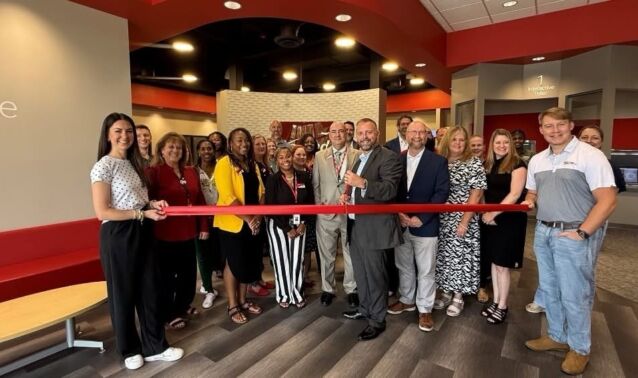 Ascend team poses for photo at ribbon cutting ceremony for new Clarksville branch.