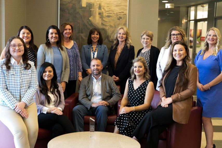 Ascend Federal Credit Union HR team and CEO pose for photo