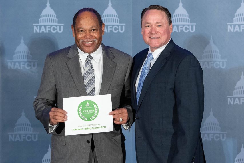 Anthony Taylor poses with award