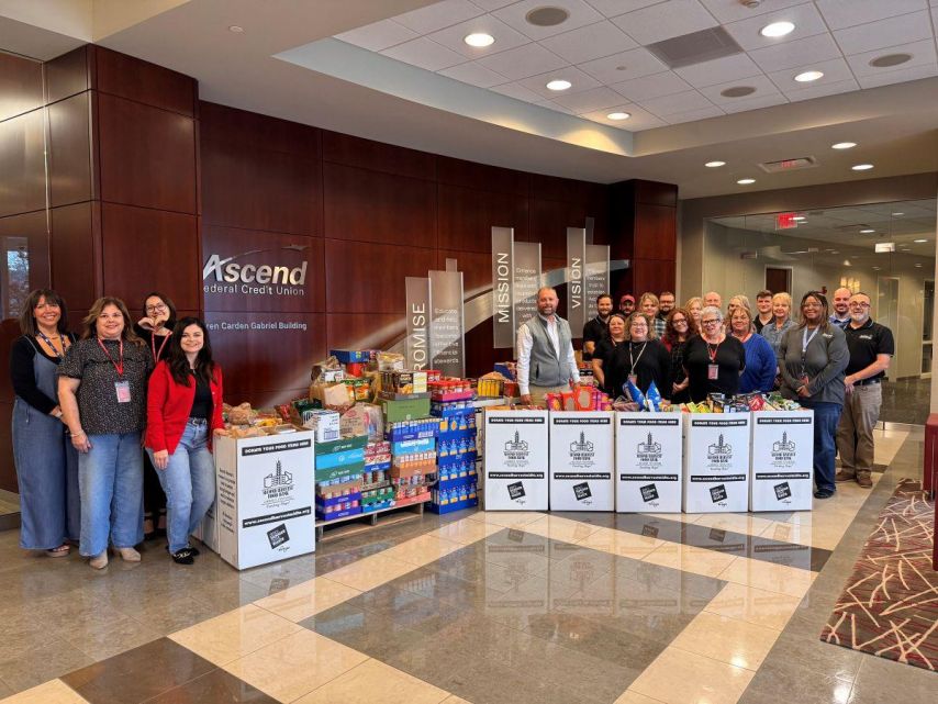 Ascend employees pose with food donations