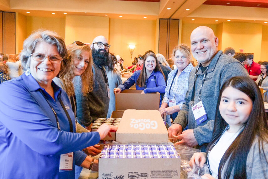 Ascend employees pack kits for Second Harvest