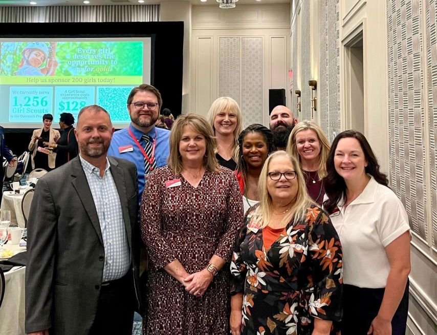 Ascend employees smiling for group photo at Girl Scouts luncheon