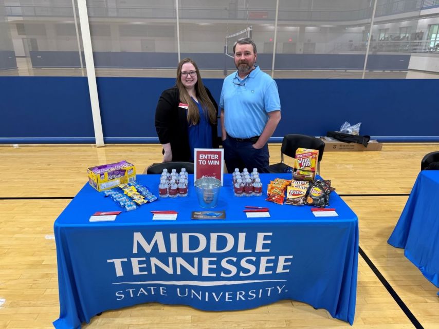 Ascend employees pose at MTSU Financial Literacy Month event.