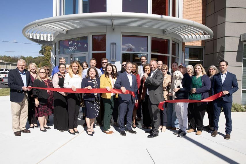 Photo of ribbon cutting ceremony to celebrate the opening of a new Ascend branch