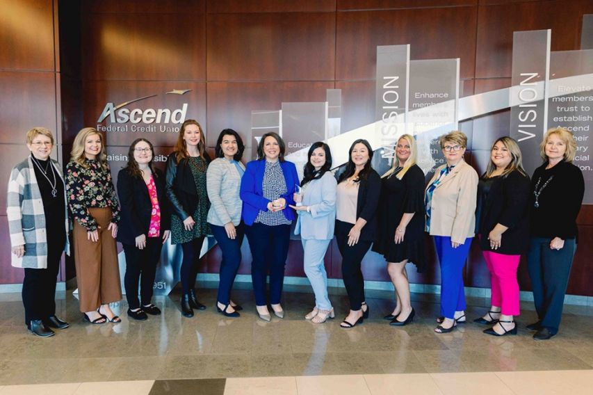 Ascend HR poses with Apex training award