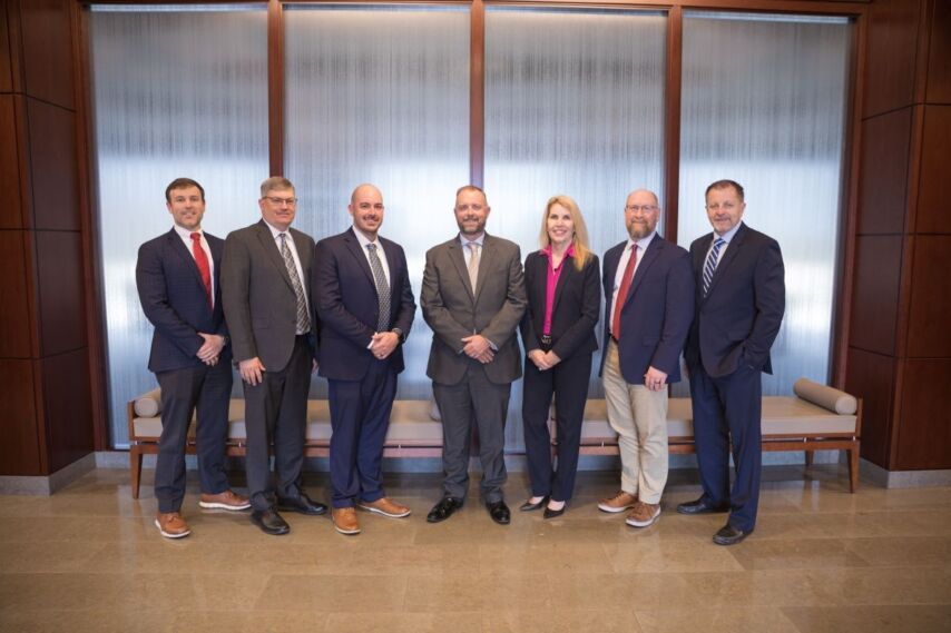 Ascend executive leadership team poses for photo