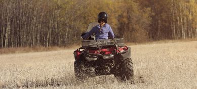 ATV driving through a field