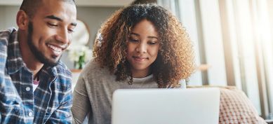 Couple working together on their laptop