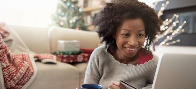 Mother using her laptop and credit card