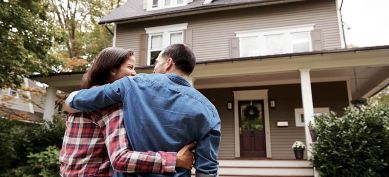 Happy couple moving into their new home