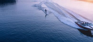 Boat with water skier on lake