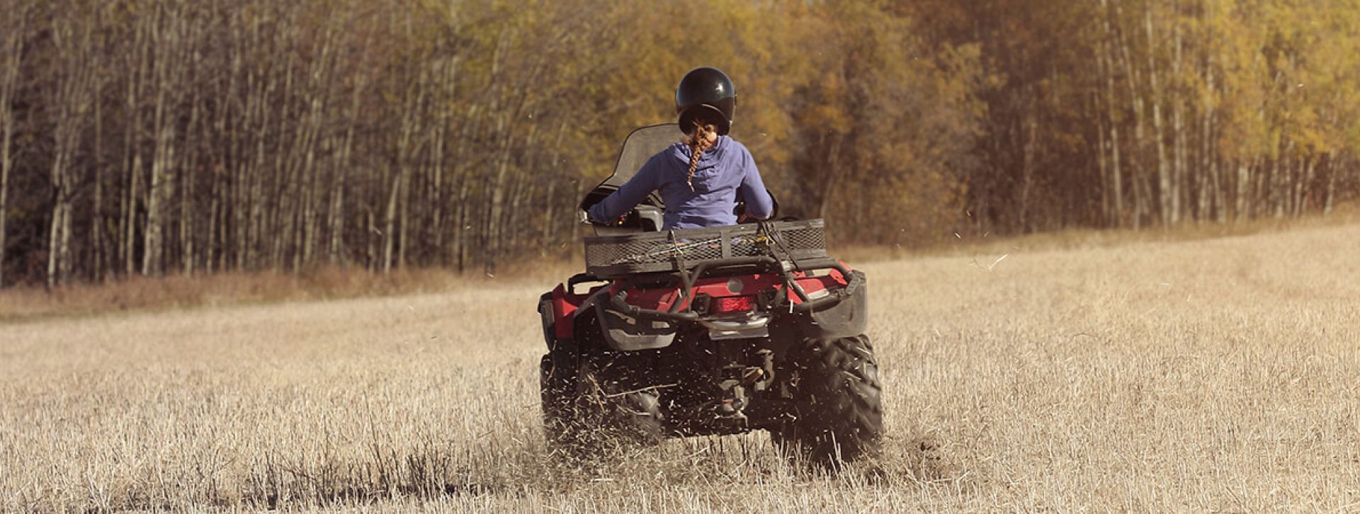 ATV driving through a field