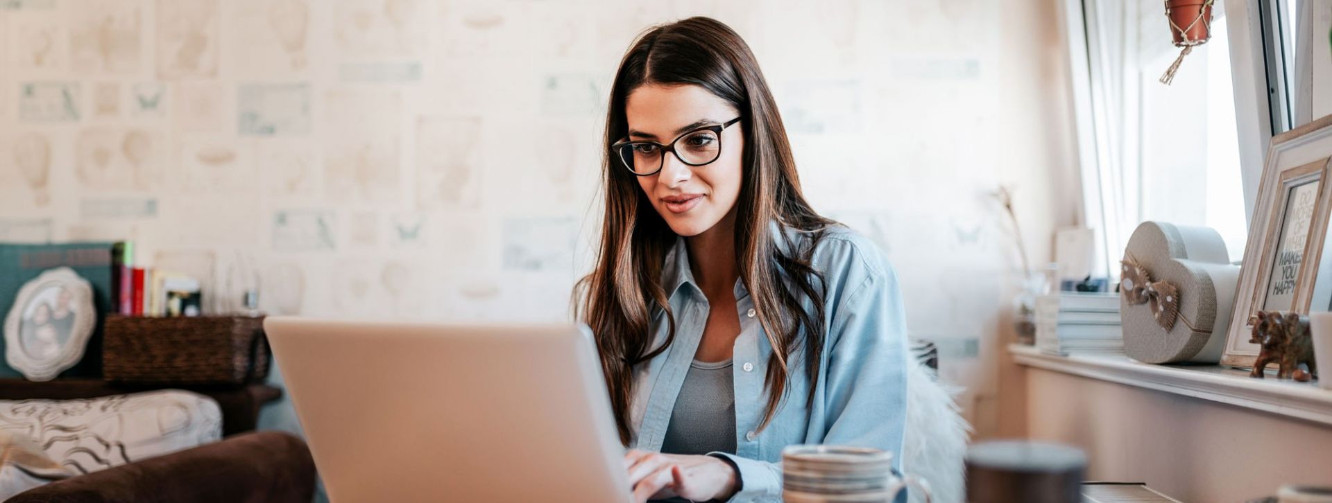 Young lady using her laptop to open an account