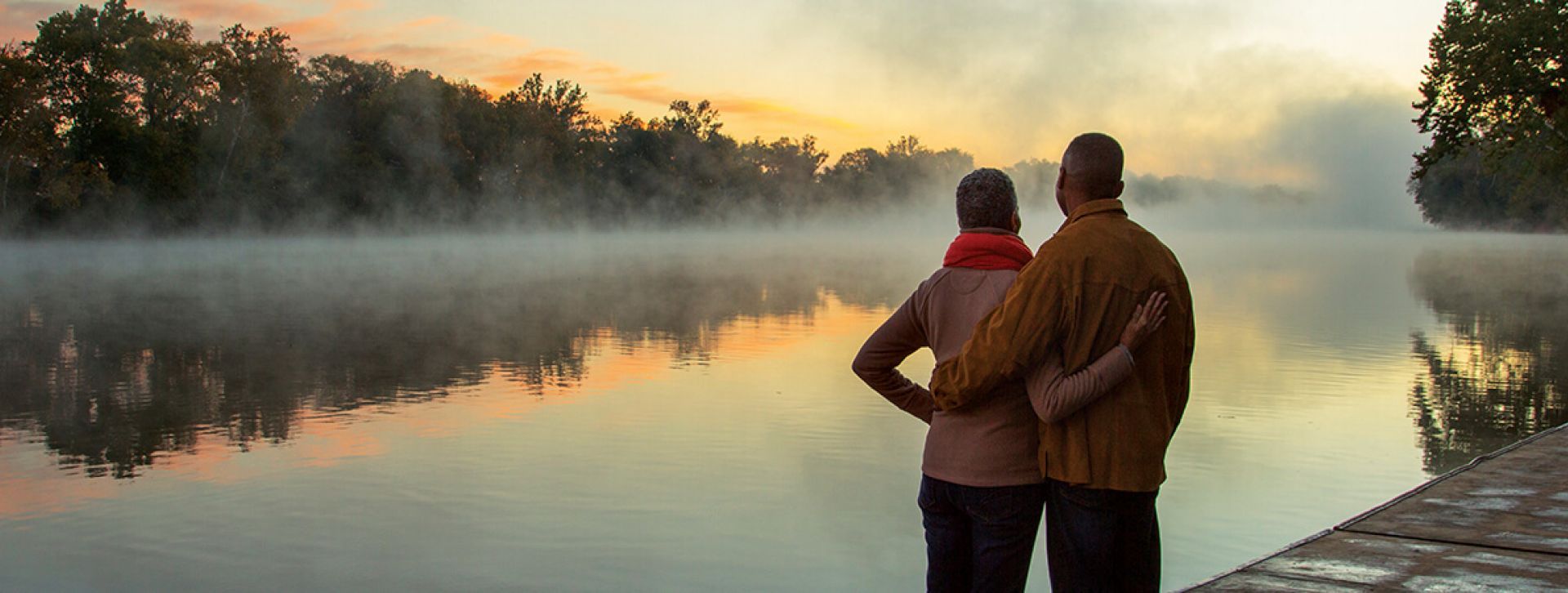 Retired couple looking over lake