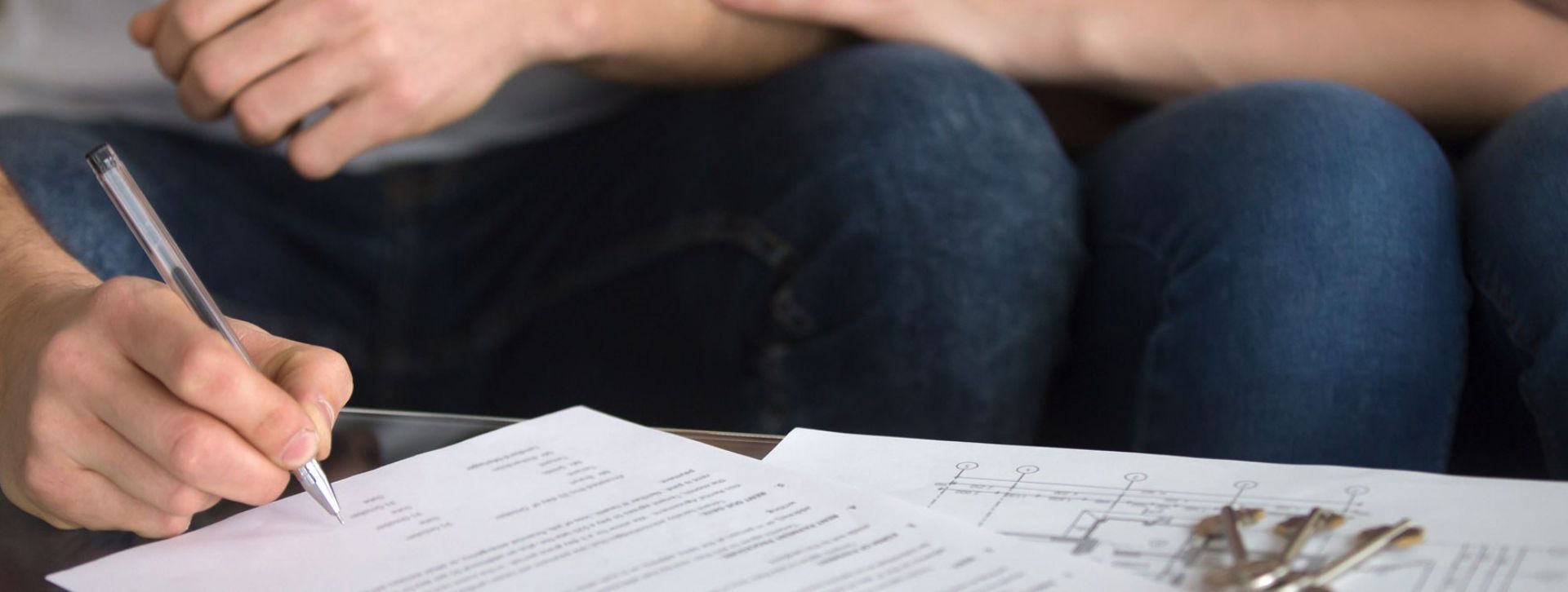 Couple signing paperwork