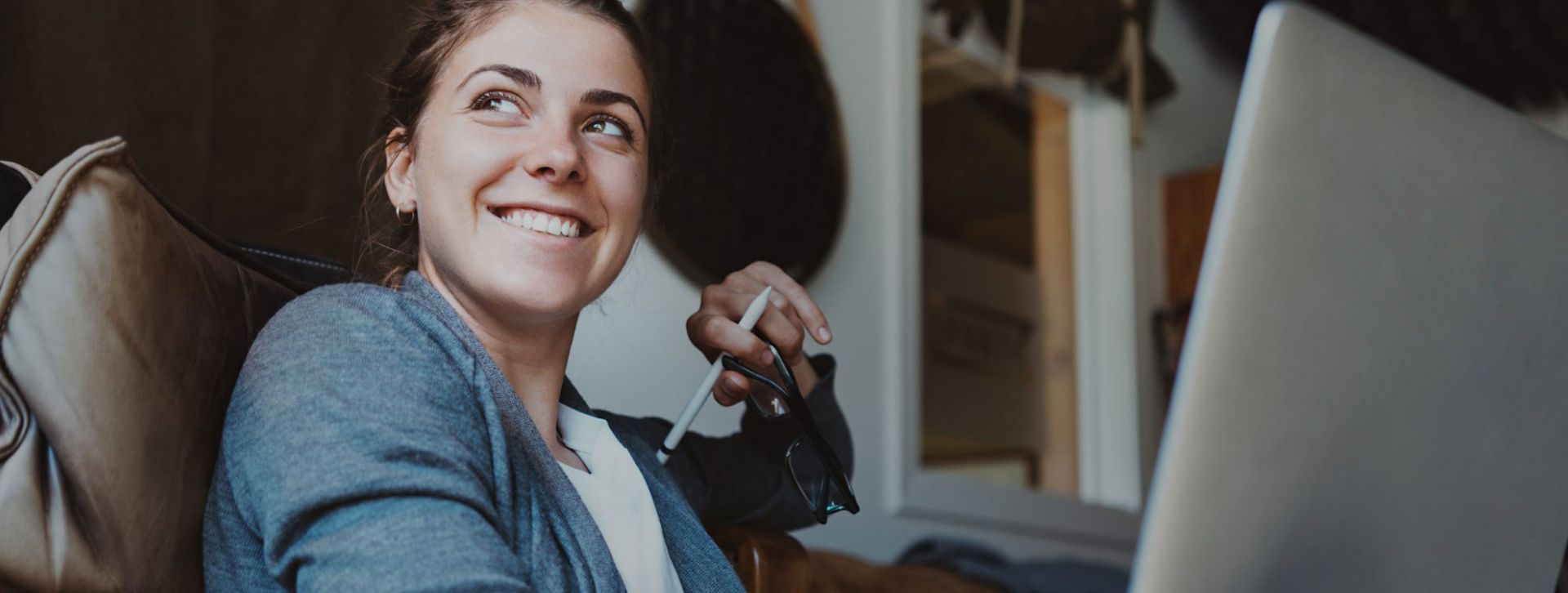 Woman smiling on her laptop