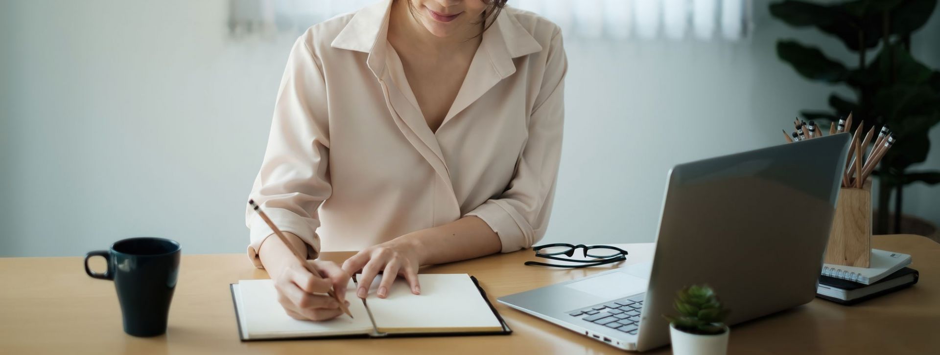 Business woman writing notes