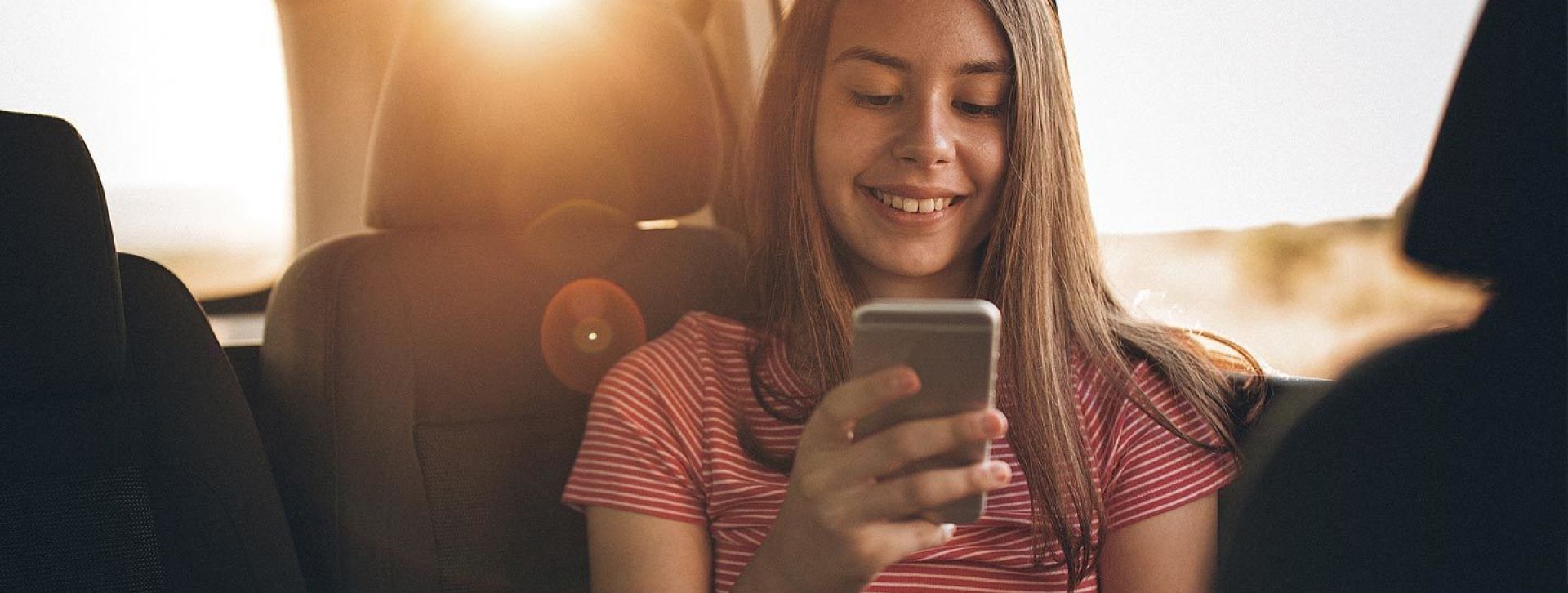 Young girl using her phone